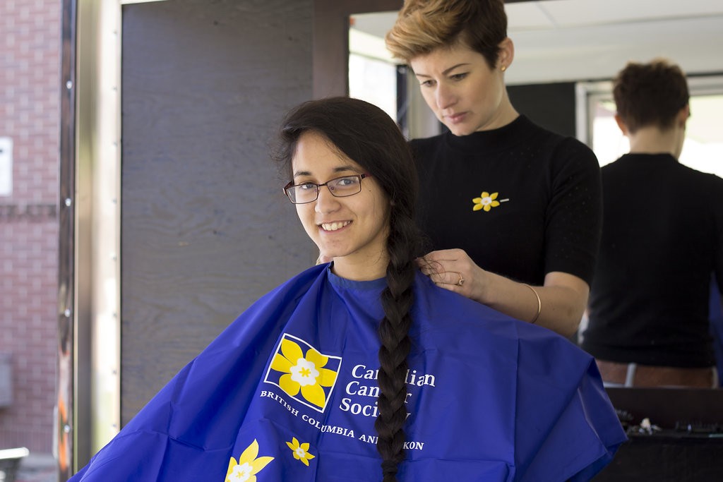 Kelowna Hair Salon - Plan B supports cuts for a cure - long braid being cut